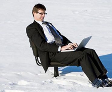 Man Typing in Snow